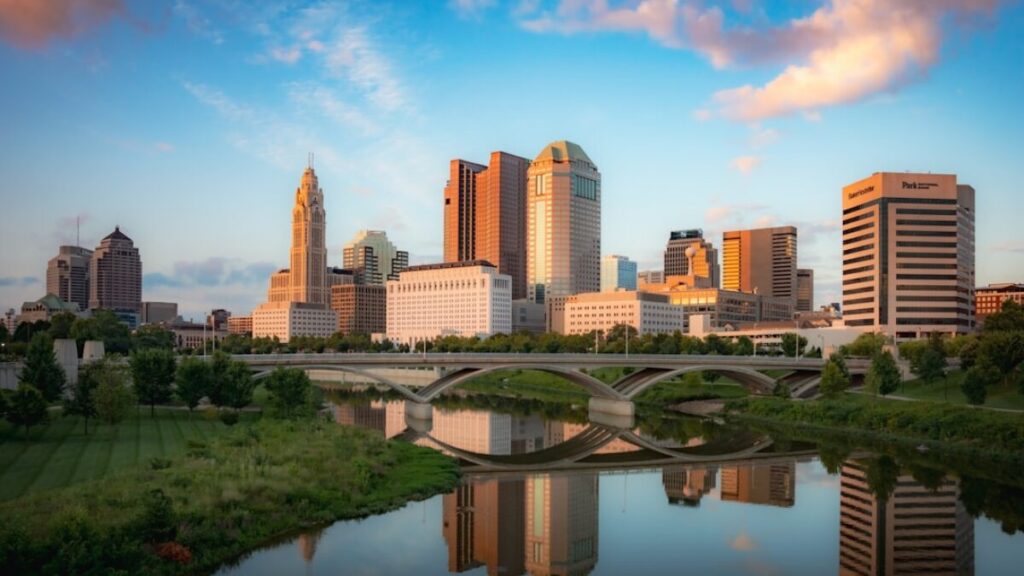 a city skyline with a river